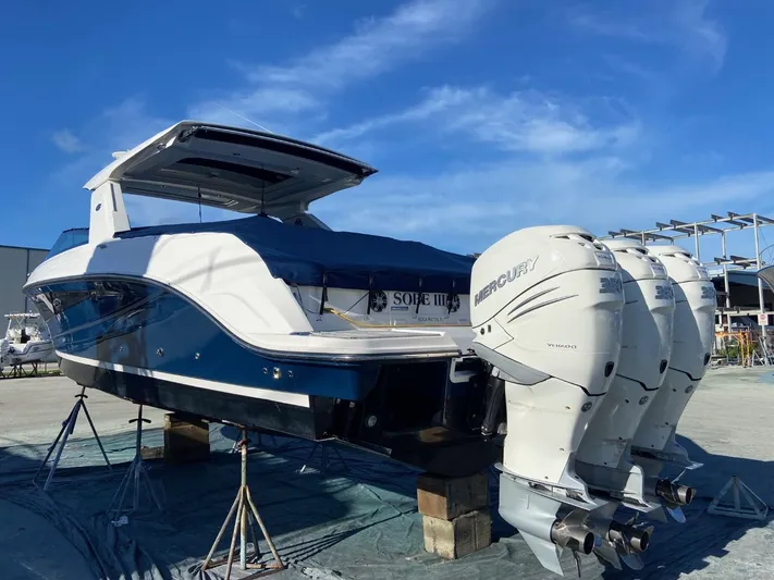 Sobe III Yacht Photos Pics 2019 Sea Ray SLX 400 Outboard boat with triple Mercury engines on display.