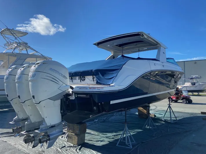 Sobe III Yacht Photos Pics 2019 Sea Ray SLX 400 Outboard boat with triple engines on display.