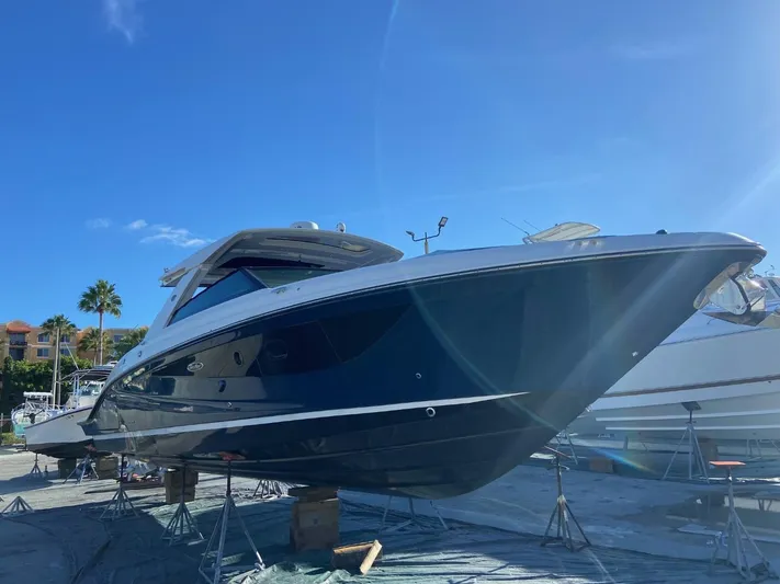 Sobe III Yacht Photos Pics 2019 Sea Ray SLX 400 Outboard boat on stands under clear blue sky.