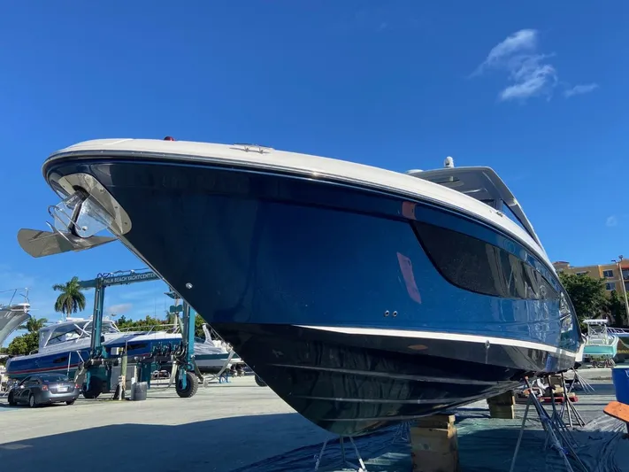 Sobe III Yacht Photos Pics 2019 Sea Ray SLX 400 Outboard boat on display under clear blue sky.