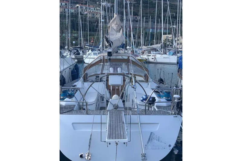  Yacht Photos Pics Grand Soleil 45 sailboat, 2003 model, docked in a marina with other boats.