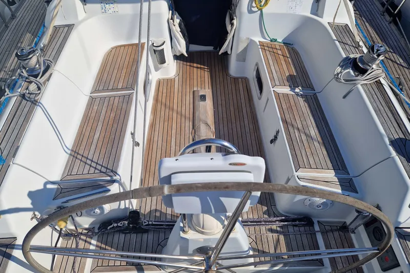  Yacht Photos Pics Cockpit of 2003 Grand Soleil 45 sailboat with wooden deck and steering wheel.