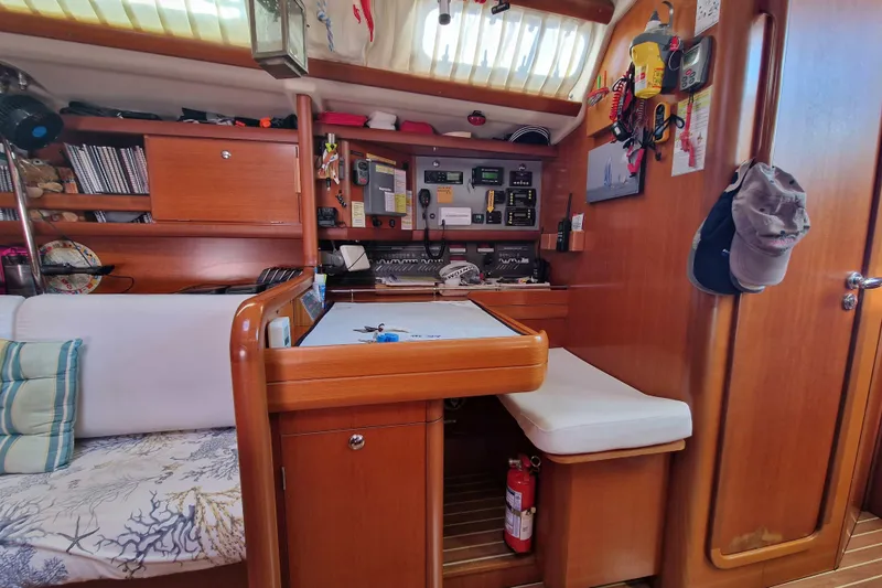  Yacht Photos Pics Interior of 2003 Grand Soleil 45 yacht with navigation station and wooden cabinetry.