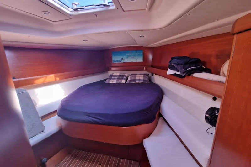  Yacht Photos Pics Cozy cabin interior of 2003 Grand Soleil 45 sailboat with wooden finish and skylight.