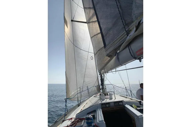  Yacht Photos Pics Sailing on a 2003 Grand Soleil 45 yacht with full sails on a sunny day.