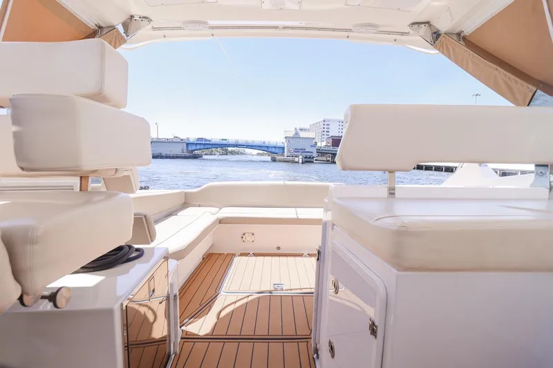 Ocean's Grace Yacht Photos Pics Interior view of 2016 Pursuit SC 365i yacht with waterfront backdrop.