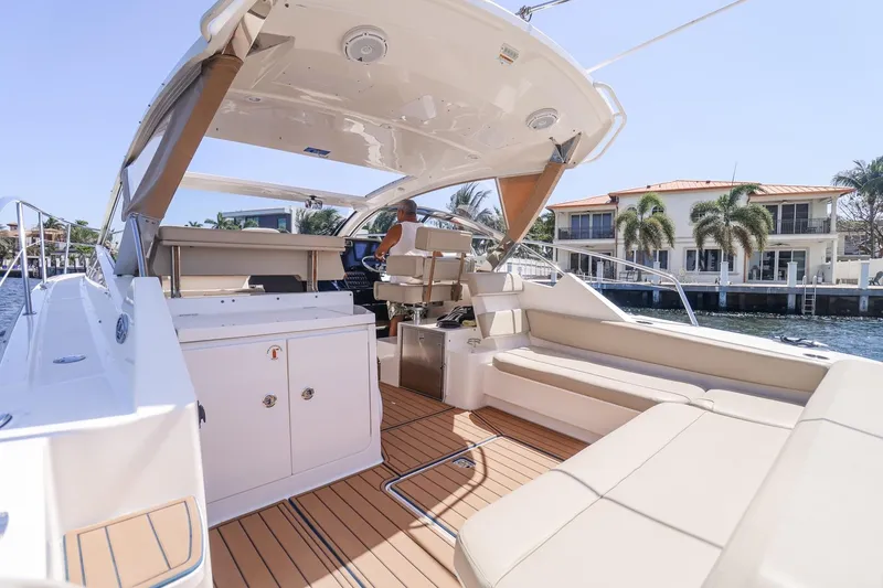 Ocean's Grace Yacht Photos Pics Luxurious 2016 Pursuit SC 365i yacht interior with spacious seating and modern amenities.