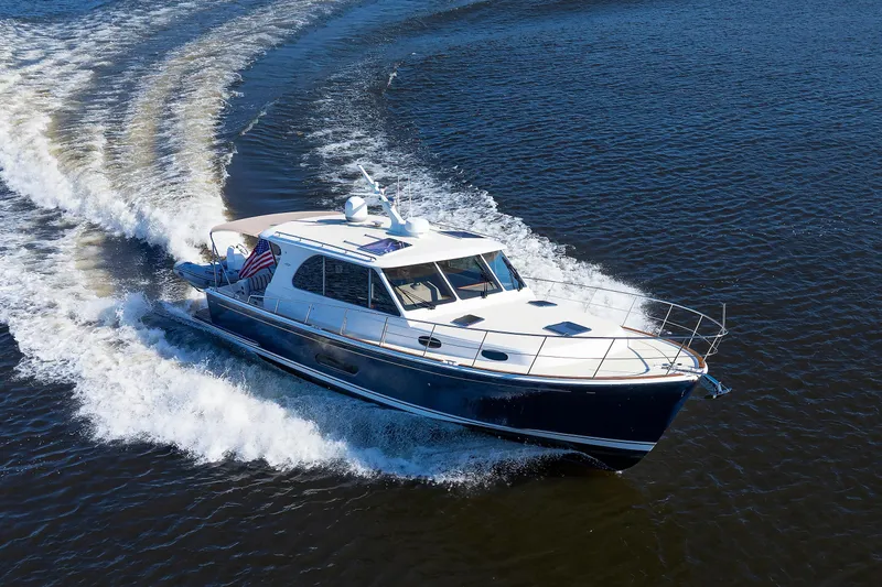 Friendly Persuasion Yacht Photos Pics 2019 Grand Banks 44 Eastbay SX cruising on open water, creating a dynamic wake.