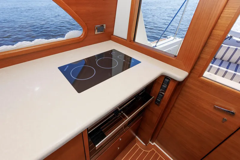 Friendly Persuasion Yacht Photos Pics 2019 Grand Banks 44 Eastbay SX yacht interior with modern kitchen and sea view.