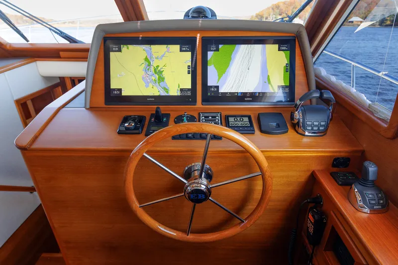 Friendly Persuasion Yacht Photos Pics Helm of 2019 Grand Banks 44 Eastbay SX with navigation screens and controls.