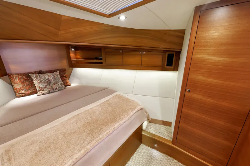 Friendly Persuasion Yacht Photos Pics Luxurious cabin interior of 2019 Grand Banks 44 Eastbay SX yacht with wooden finishes.