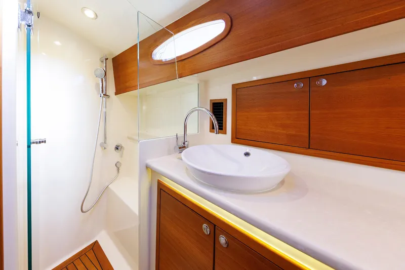 Friendly Persuasion Yacht Photos Pics Luxurious bathroom in 2019 Grand Banks 44 Eastbay SX yacht with modern fixtures.