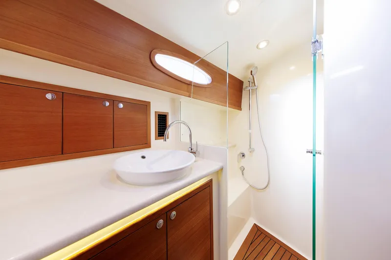 Friendly Persuasion Yacht Photos Pics Luxurious bathroom in 2019 Grand Banks 44 Eastbay SX yacht with modern fixtures.