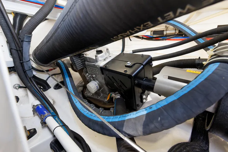 Friendly Persuasion Yacht Photos Pics Engine compartment of 2019 Grand Banks 44 Eastbay SX with visible hoses and components.