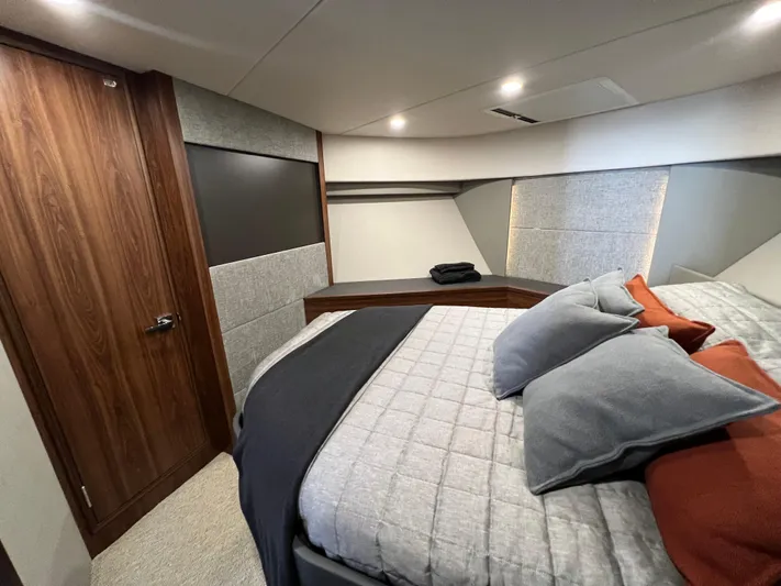  Yacht Photos Pics Luxurious bedroom interior of 2023 Maritimo M600 yacht with modern design and cozy bedding.