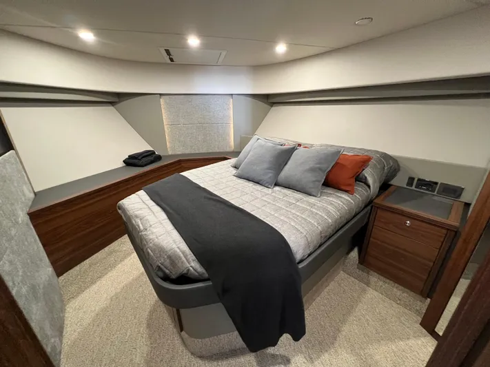  Yacht Photos Pics Luxurious bedroom interior of 2023 Maritimo M600 yacht with modern design and cozy bedding.