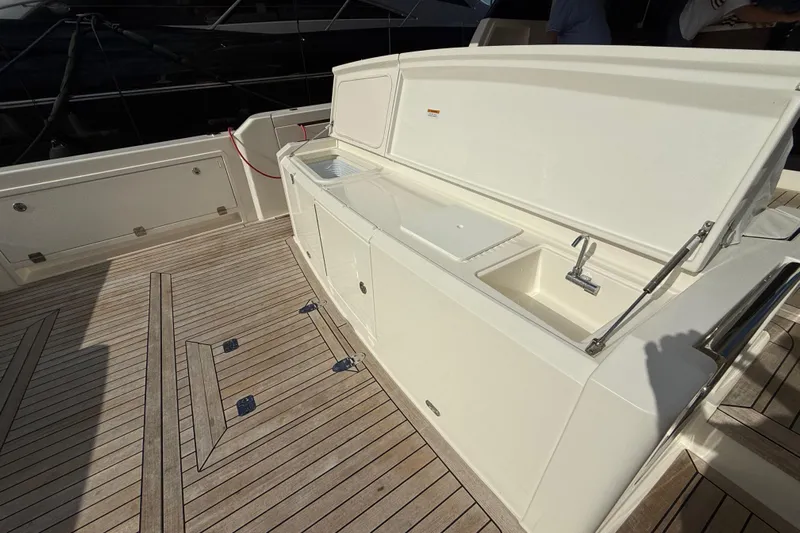 Yacht Photos Pics 2023 Maritimo M600 yacht deck with sink and storage area.