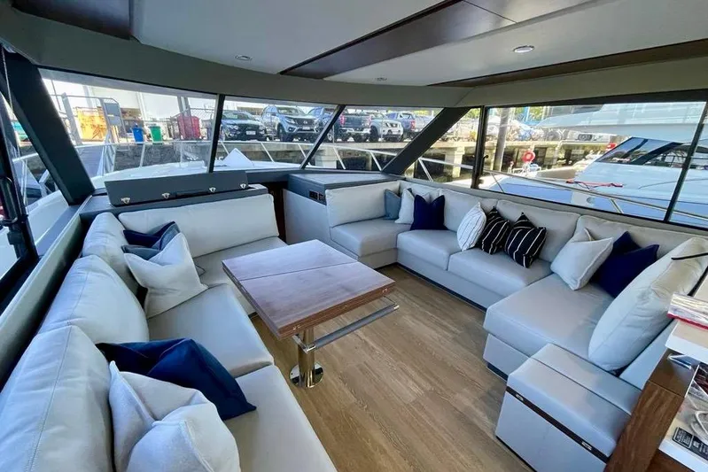  Yacht Photos Pics Luxurious interior of 2023 Maritimo M600 yacht with plush seating and elegant decor.