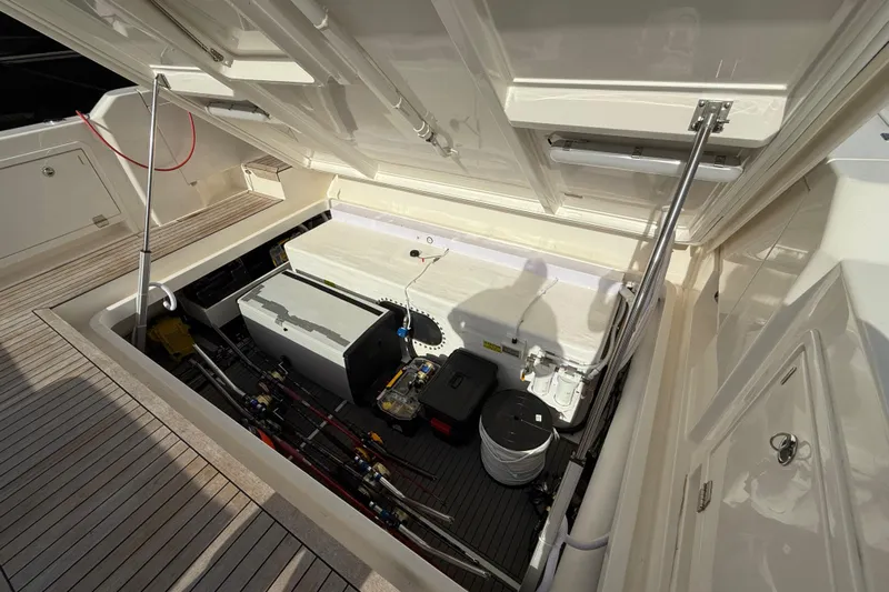  Yacht Photos Pics 2023 Maritimo M600 yacht storage compartment with equipment and supplies.