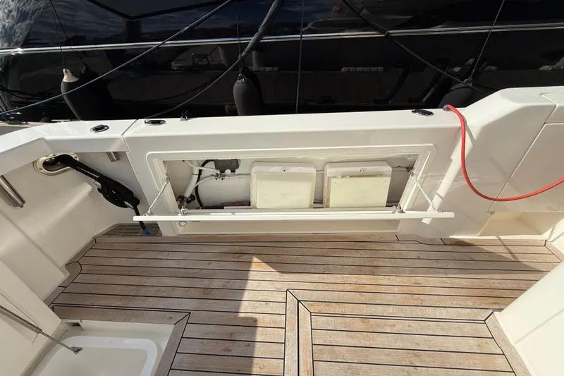  Yacht Photos Pics 2023 Maritimo M600 yacht deck with storage compartment and teak flooring.