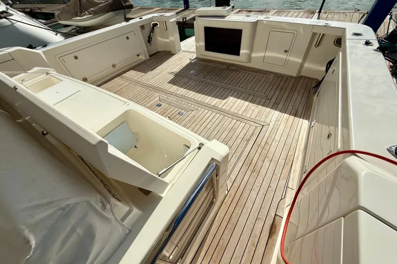  Yacht Photos Pics Spacious deck of 2023 Maritimo M600 yacht with wooden flooring and storage compartments.