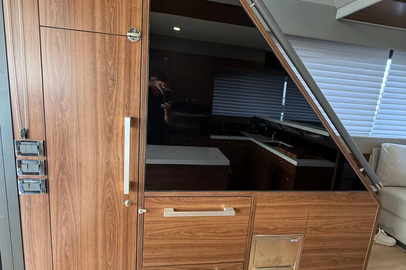  Yacht Photos Pics 2023 Maritimo M600 yacht interior with wood paneling and modern design elements.