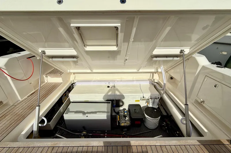  Yacht Photos Pics 2023 Maritimo M600 yacht engine compartment with open hatch, showcasing mechanical components.