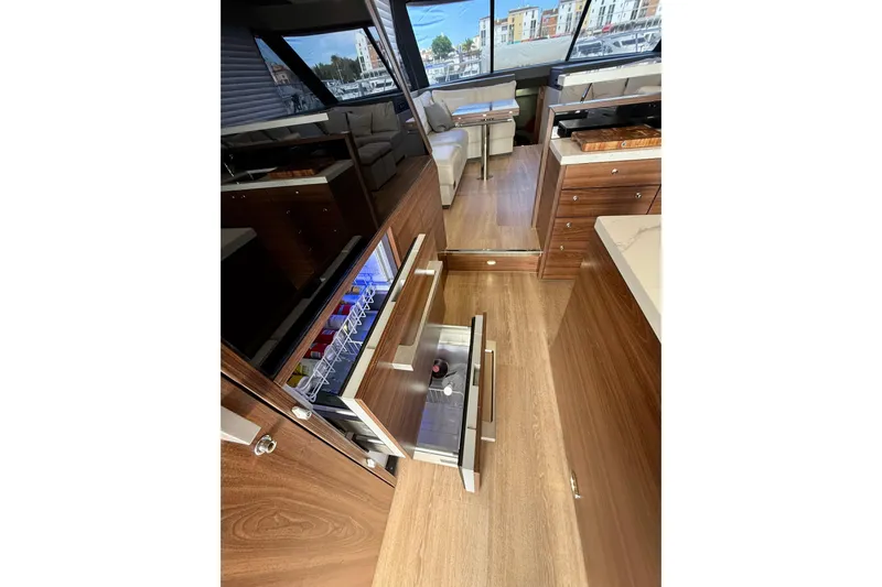  Yacht Photos Pics Luxurious interior of 2023 Maritimo M600 yacht with open drawers and modern design.