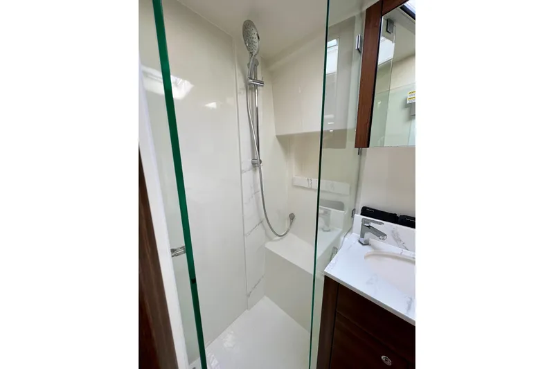  Yacht Photos Pics Modern shower area in 2023 Maritimo M600 yacht bathroom.
