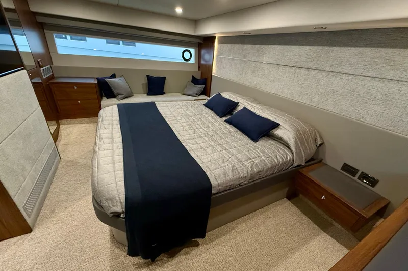  Yacht Photos Pics Luxurious 2023 Maritimo M600 yacht bedroom with elegant bedding and modern design.