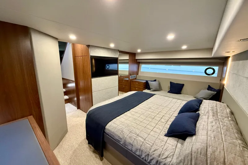  Yacht Photos Pics Luxurious bedroom interior of 2023 Maritimo M600 yacht with modern design and cozy ambiance.