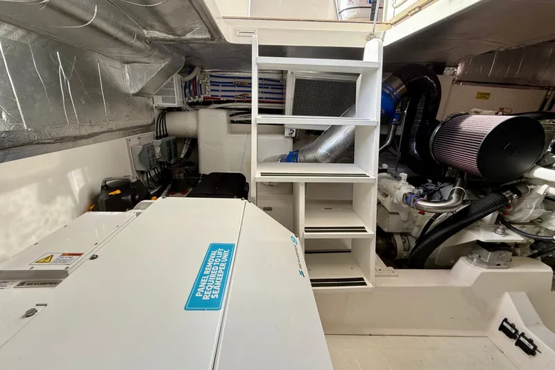  Yacht Photos Pics Engine room of 2023 Maritimo M600 yacht, showcasing mechanical components and storage.