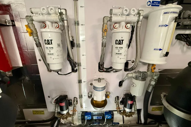  Yacht Photos Pics Engine room of 2023 Maritimo M600 yacht with CAT filters and hydraulic system.