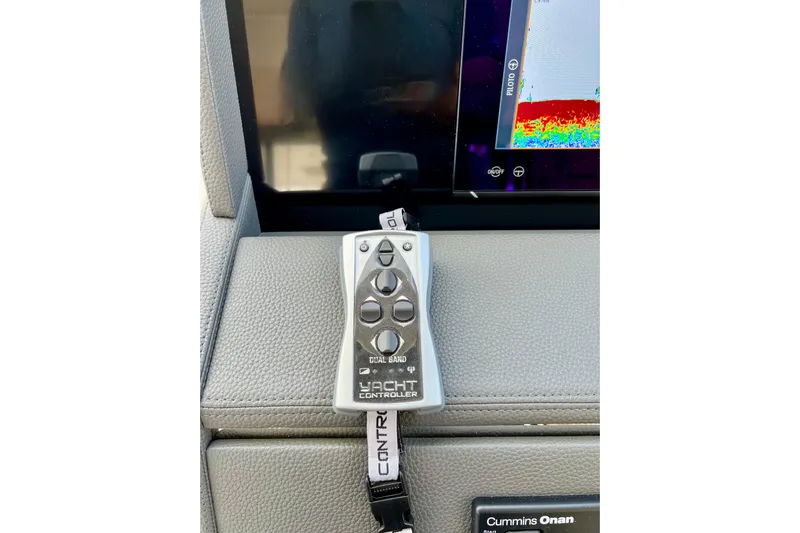 Yacht Photos Pics Remote control on Maritimo M600 yacht dashboard, 2023 model, with navigation display.