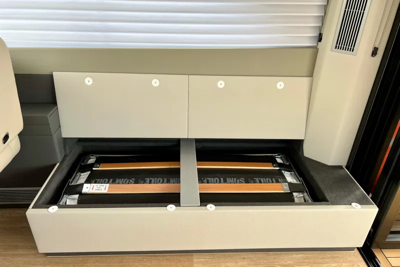  Yacht Photos Pics 2023 Maritimo M600 interior storage compartment with open lid, showcasing organized space.