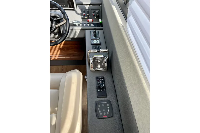  Yacht Photos Pics 2023 Maritimo M600 helm with modern controls and steering wheel.