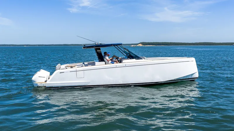  Yacht Photos Pics 2023 Pardo Yachts 38 cruising on open water under clear blue skies.