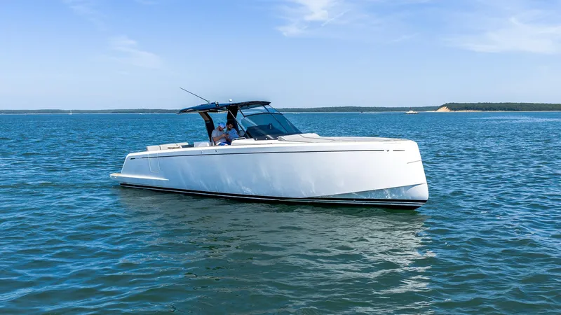  Yacht Photos Pics 2023 Pardo Yachts 38 cruising on open water under a clear blue sky.