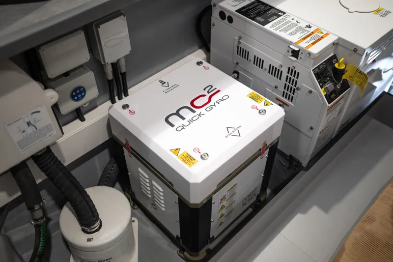 Maxim Yachts | Max43 Race Yacht Photos Pics Maxim Yachts 43 (2025) engine room featuring MC2 Quick Gyro stabilizer and electrical components.