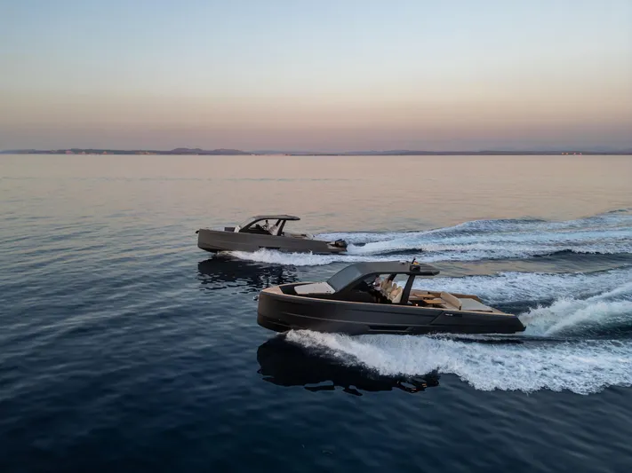 Maxim Yachts | Max43 Race Yacht Photos Pics Two Maxim Yachts 43 models cruising on calm waters at sunset, 2025.