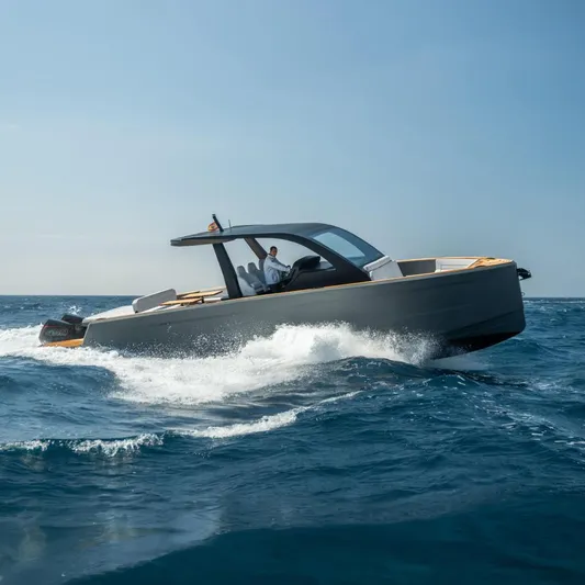 Maxim Yachts | Max43 Race Yacht Photos Pics 2025 Maxim Yachts 43 cruising on open sea under clear blue sky.