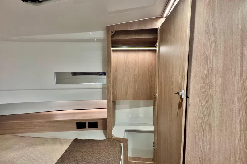 Maxim Yachts | Max43 Race Yacht Photos Pics Interior of 2025 Maxim Yachts 43 Race, featuring wooden cabinetry and modern design.