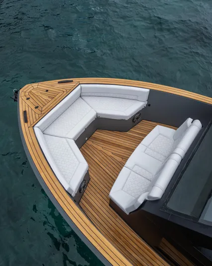 Maxim Yachts | Max43 Race Yacht Photos Pics Luxurious 2025 Maxim Yachts 43 with elegant seating and teak deck on clear water.