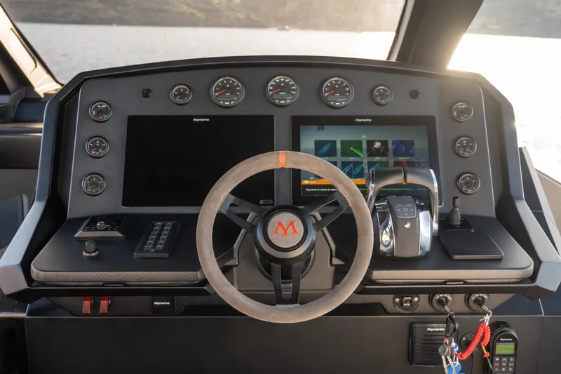 Maxim Yachts | Max43 Race Yacht Photos Pics Helm of 2025 Maxim Yachts 43, featuring advanced navigation displays and controls.