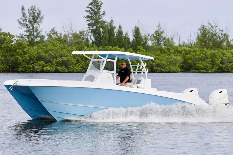  Yacht Photos Pics Manufacturer Provided Image: 2021 Twin Vee 280 CC GF boat cruising on a calm lake.