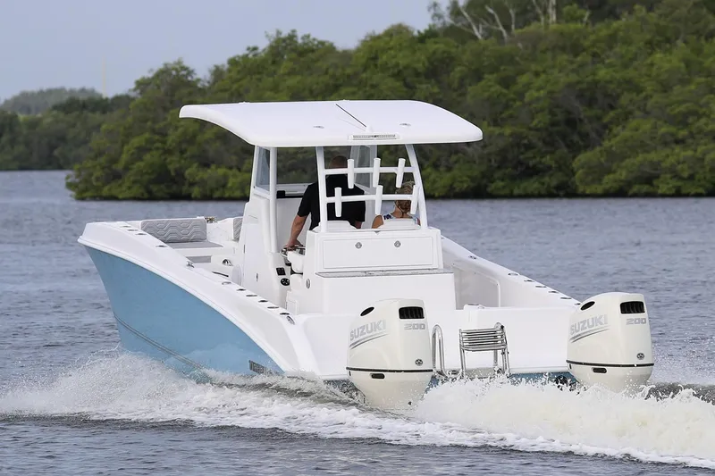  Yacht Photos Pics Manufacturer Provided Image: 2021 Twin Vee 280 CC GF boat cruising on a river with twin Suzuki engines.
