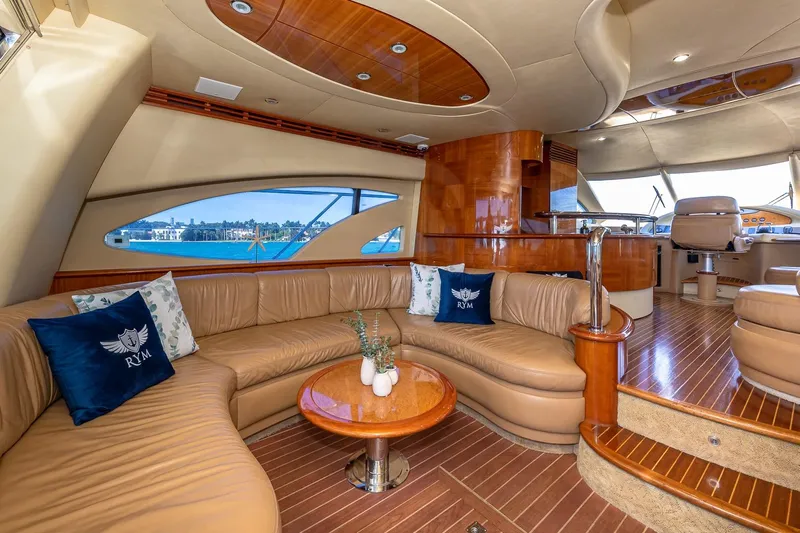 L’chaim Yacht Photos Pics Luxurious interior of 2007 Azimut Fly 62 yacht with elegant seating and wooden finishes.