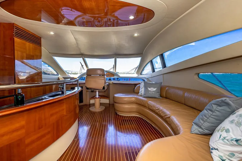 L’chaim Yacht Photos Pics Luxurious interior of 2007 Azimut Fly 62 yacht with leather seating and wooden finishes.