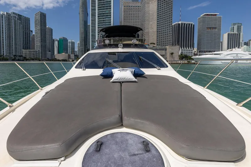 L’chaim Yacht Photos Pics 2007 Azimut Fly 62 yacht with sunbathing deck, city skyline in background.
