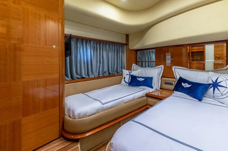 L’chaim Yacht Photos Pics Luxurious twin cabin interior of 2007 Azimut Fly 62 yacht with nautical-themed decor.